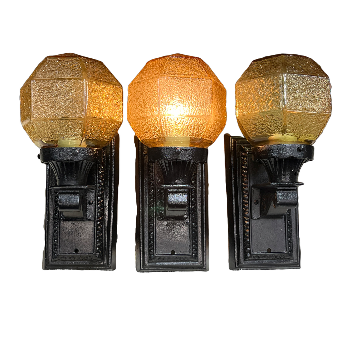 Three Outdoor Lights with Amber Shades