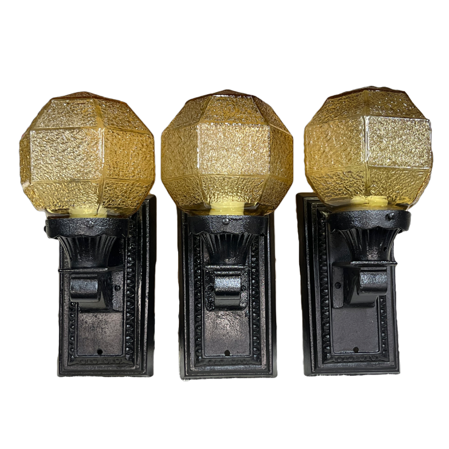 Three Outdoor Lights with Amber Shades